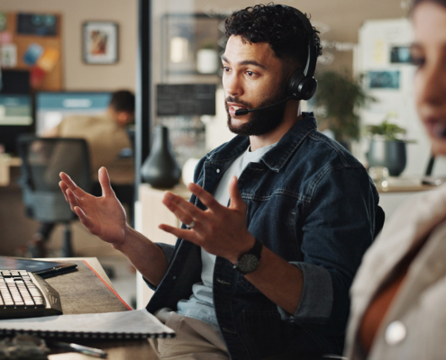 Businessman, agent or tech support with headphones at call center